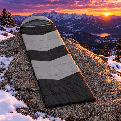 Gray heated sleeping bag on mountain rock